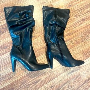 Black heel boots. Brand new, still have tag.